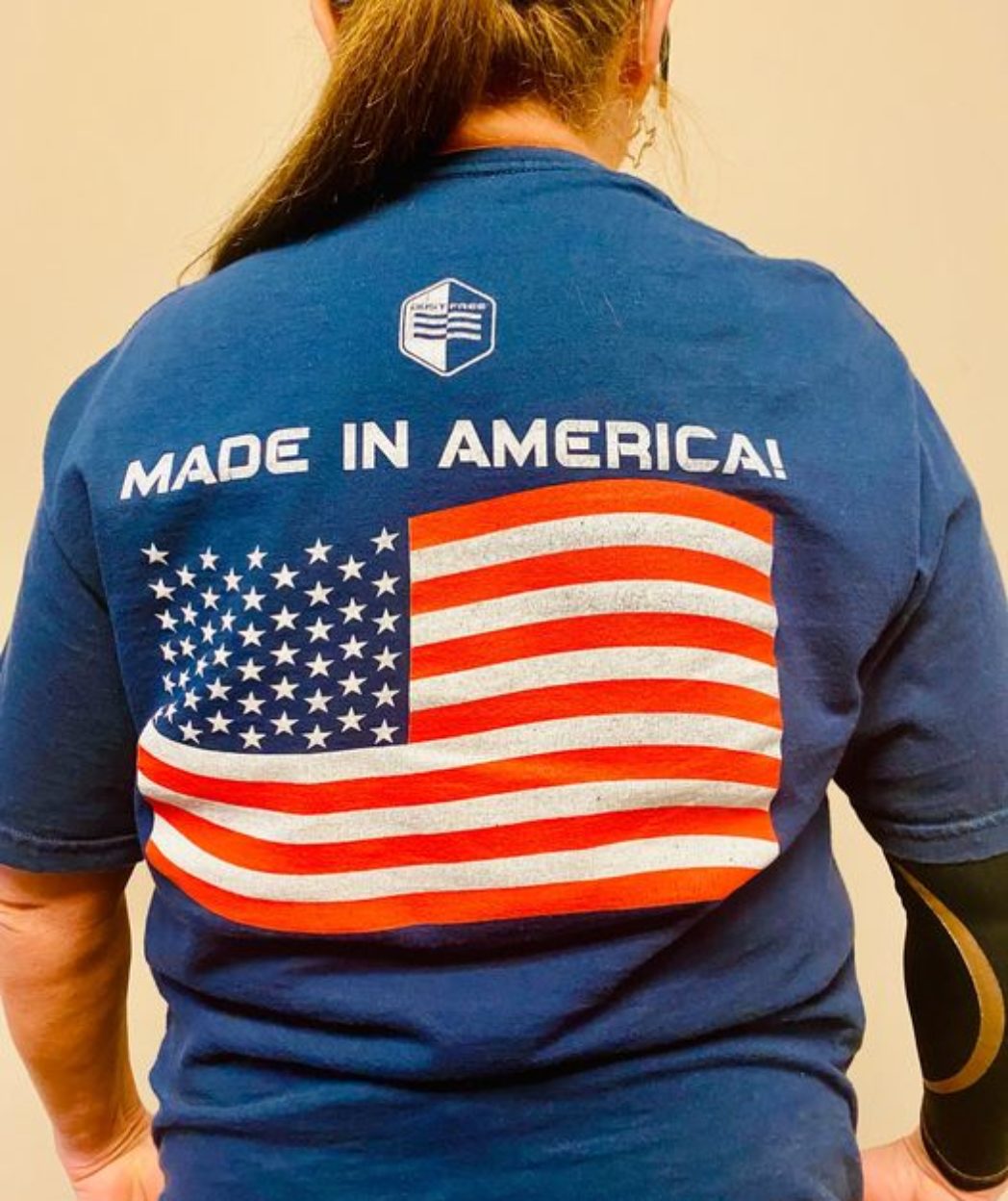 Woman wearing made in america shirt.